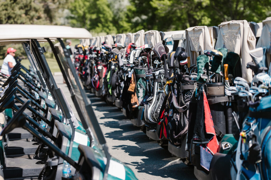 Golf carts and gear at 25th annual SCT&I charity golf tournament