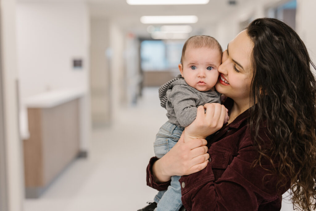 Smiling mother and infant in hospital